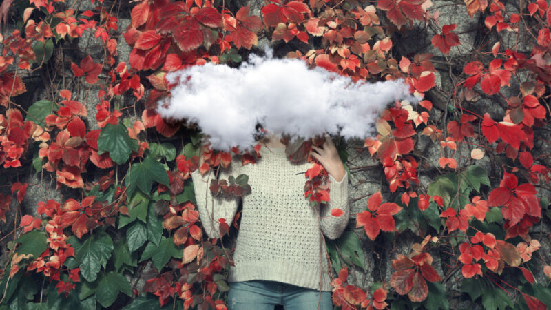 A woman hiding behind a cloud.