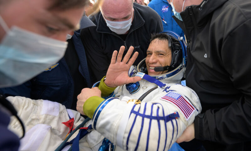 NASA astronaut Frank Rubio smiles and waves moments after arriving back on Earth to wrap up more than a year in orbit.