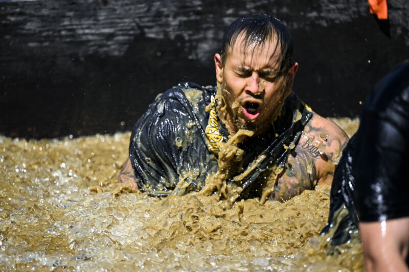 Competitors take part in "Tough Mudder" at the Glen Helen Raceway in San Bernardino, California, United States on April 2, 2023.