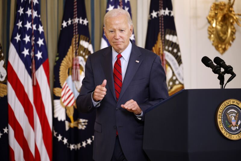 President Joe Biden gives a thumbs-up after delivering remarks to an audience.