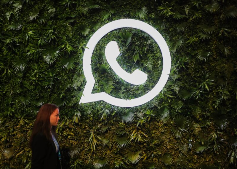 A logo for the chat application WhatsApp depicts a telephone handset inside a chat bubble.