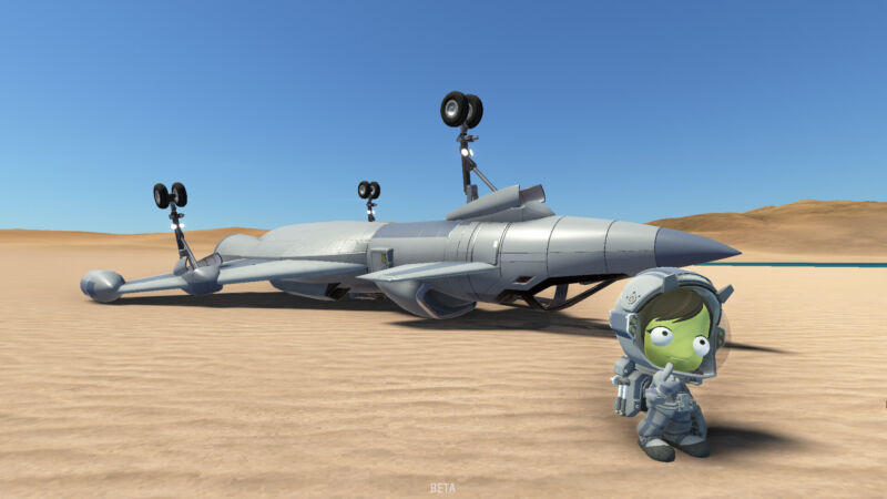 Kerbal character next to an overturned aircraft.