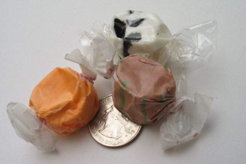 Salt water taffy with a U.S. quarter for scale