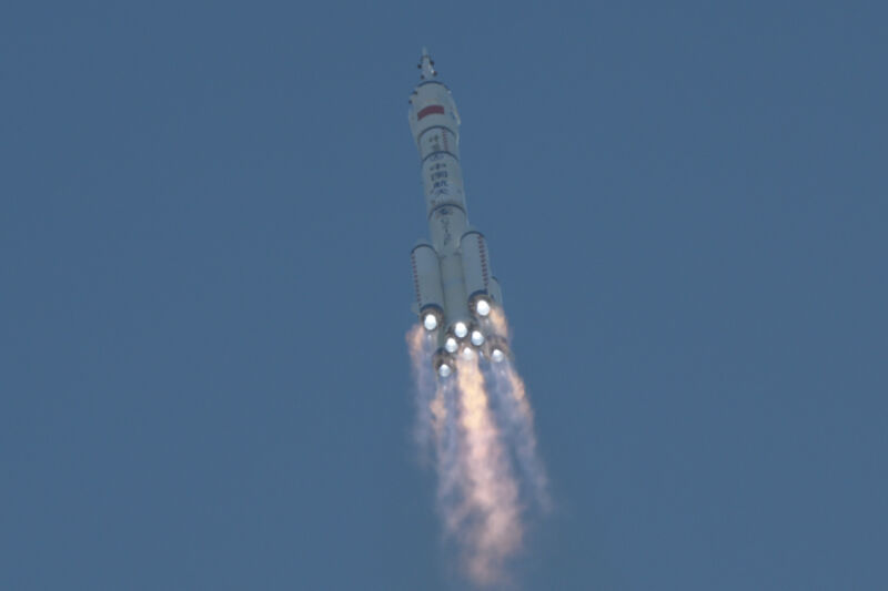 A Long March 2F rocket climbed into space Thursday with a three-man crew heading for China's Tiangong space station.