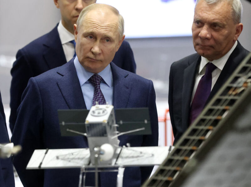 Russian President Vladimir Putin (L) and Roscosmos Space Corporation Chief Yuri Borisov peruse an exhibit while visiting the Korolev Rocket and Space Corporation Energia, October 26, 2023, in Korolev, Russia.