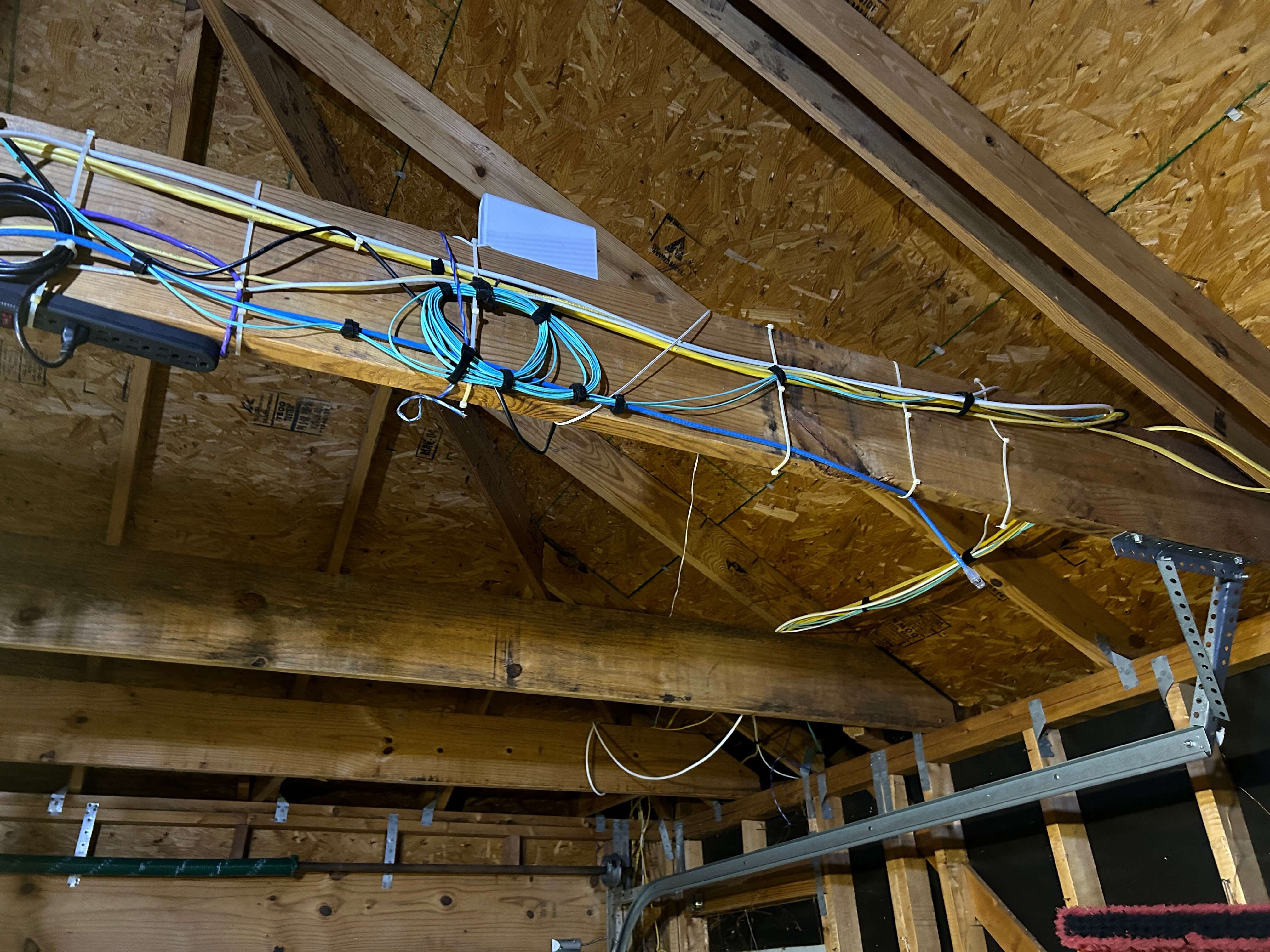 The back side of the beam on which the switch is mounted. This also sort of shows the fiber run coming into the garage.