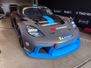 A grey and blue Porsche 718 Cayman GT4 ePerformance