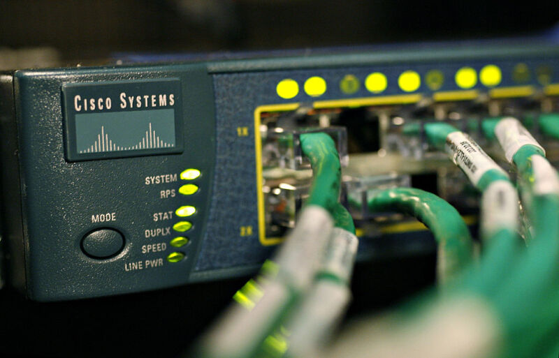Cables run into a Cisco data switch.