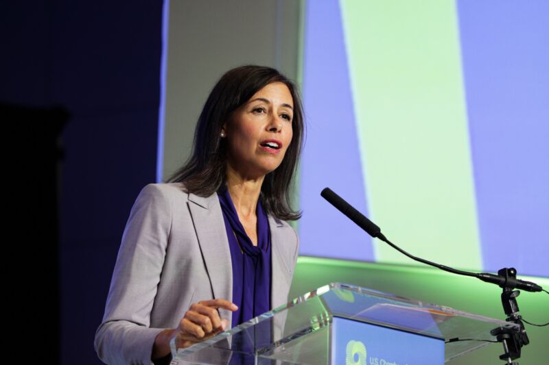 FCC Chairwoman Jessica Rosenworcel speaks at an event while standing on a stage in front of a microphone.