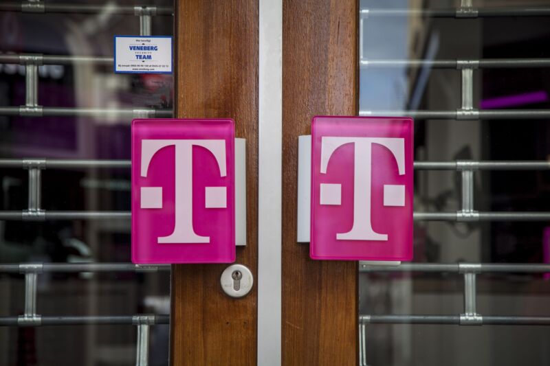 The T-Mobile logo on the doors of a T-Mobile store.