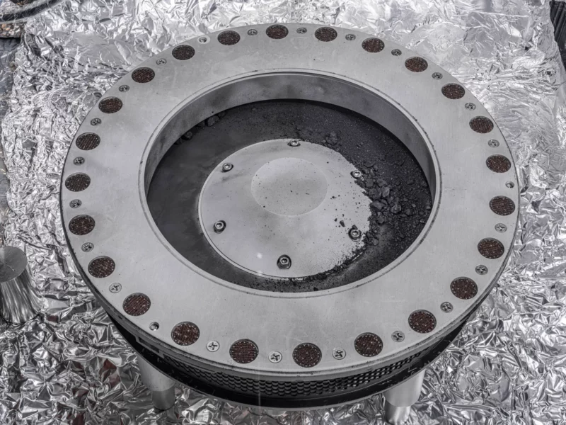 A view of the outside of the OSIRIS-REx sample collector. Scientists have found evidence of both carbon and water in initial analysis of this material. The bulk of the sample is located inside.