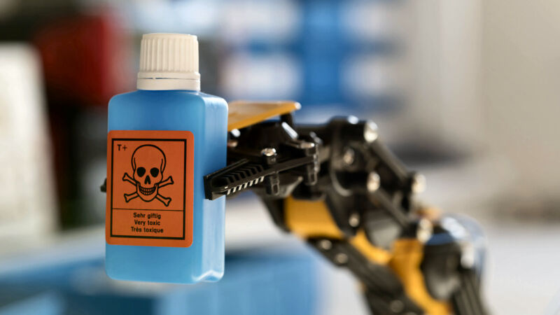 Robotic arm holding dangerous chemical.