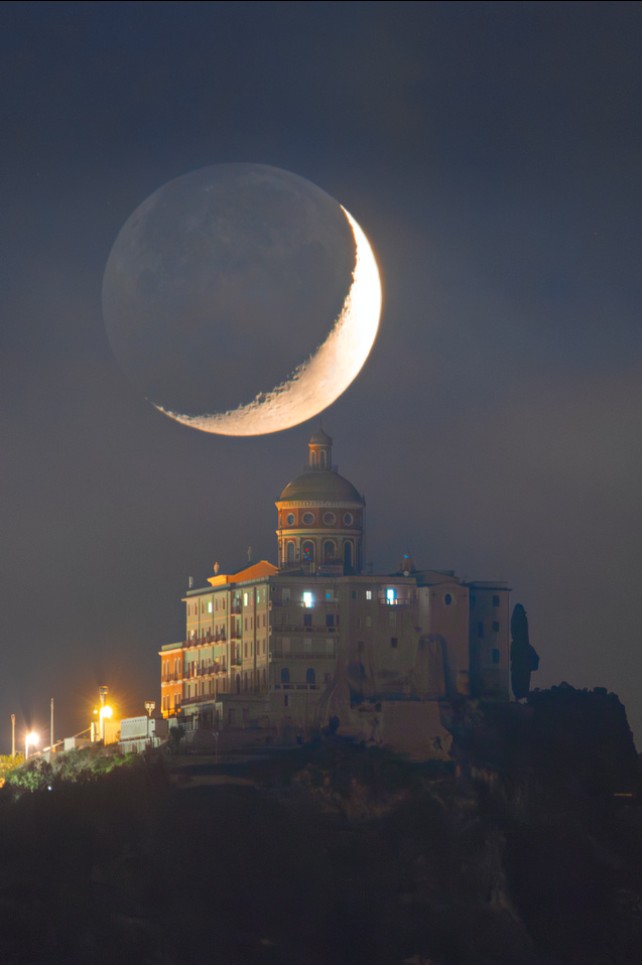 The Moon rises over Tindari, Sicily.