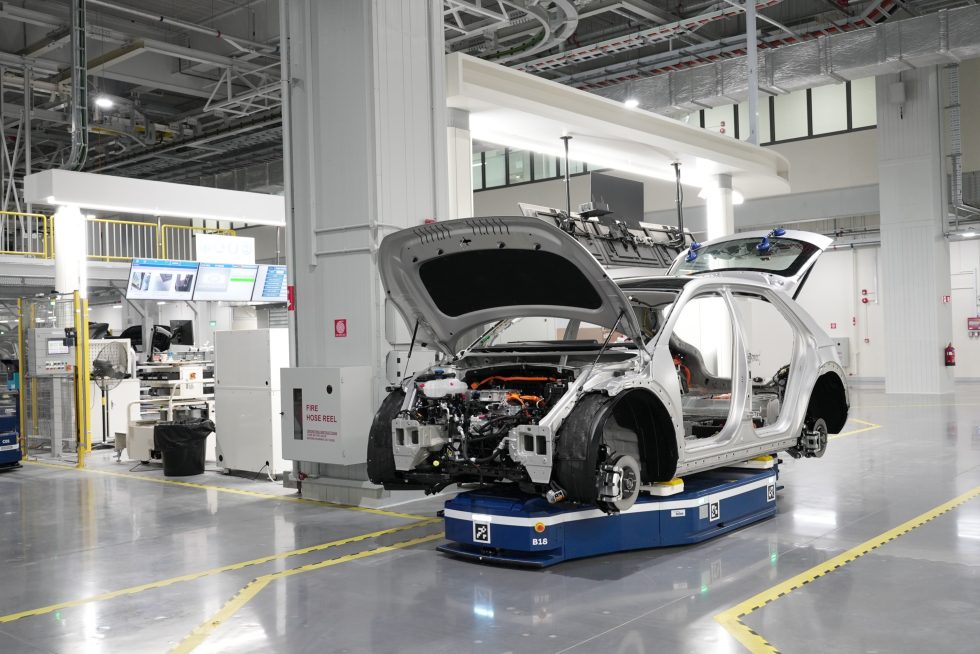 Robots move the car from cell to cell.