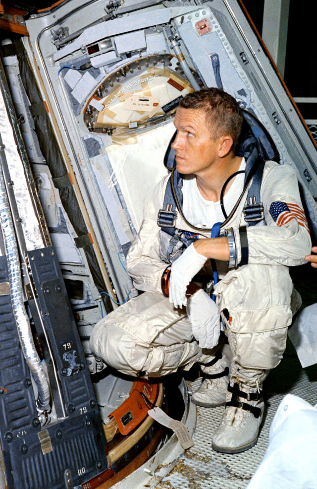 Frank Borman looks at his Gemini 7 spacecraft.