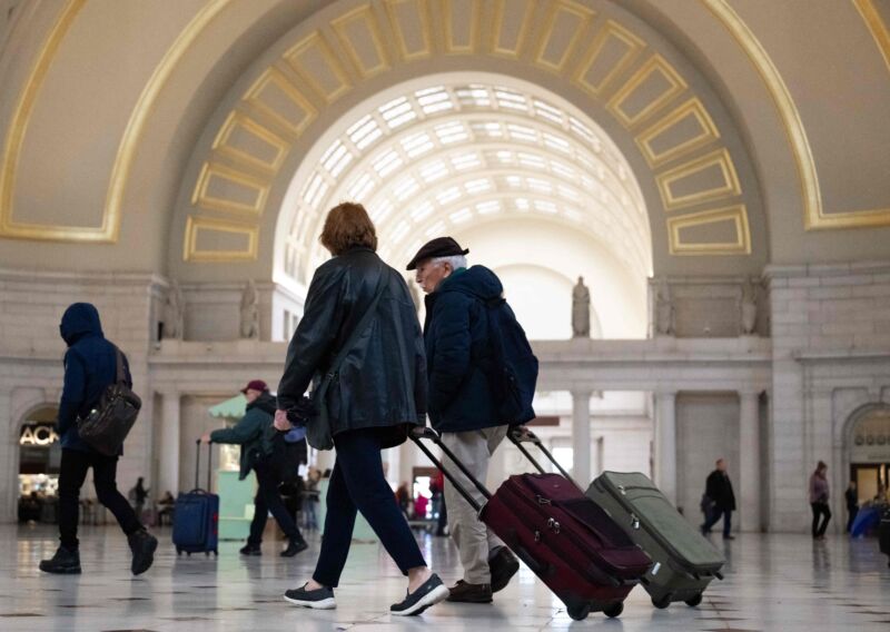 Travelers walk through Union Station as they travel ahead of the Thanksgiving holiday in Washington, DC, November 21, 2023.