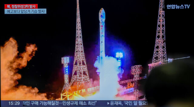 A television monitor at a train station in South Korea shows an image of the launch of North Korea's Chollima-1 rocket last year.