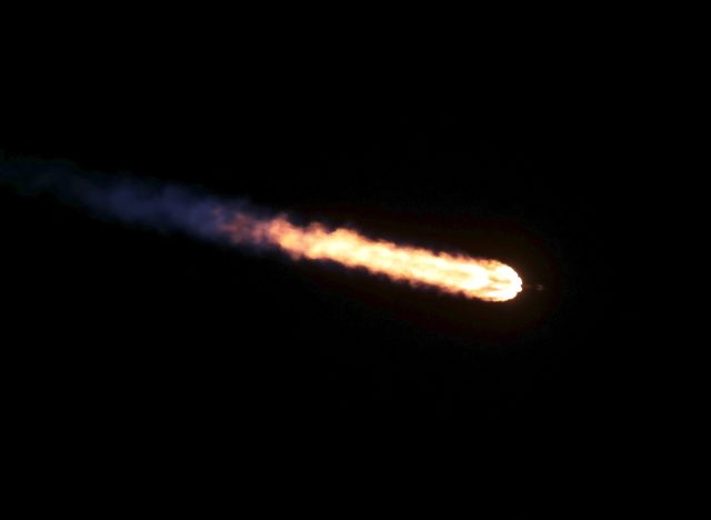 SpaceX's Falcon 9 rocket heads downrange Friday night, with its nine Merlin engines burning kerosene and liquid oxygen.