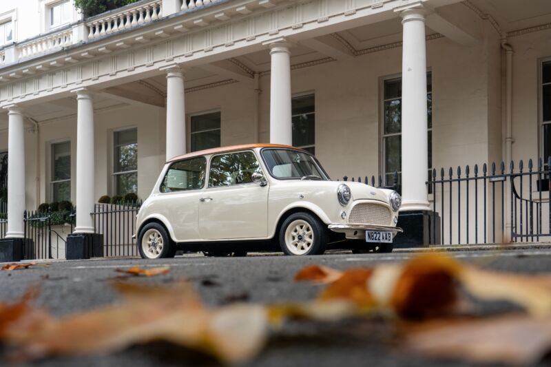 A cream mini Cooper restomod parked in London