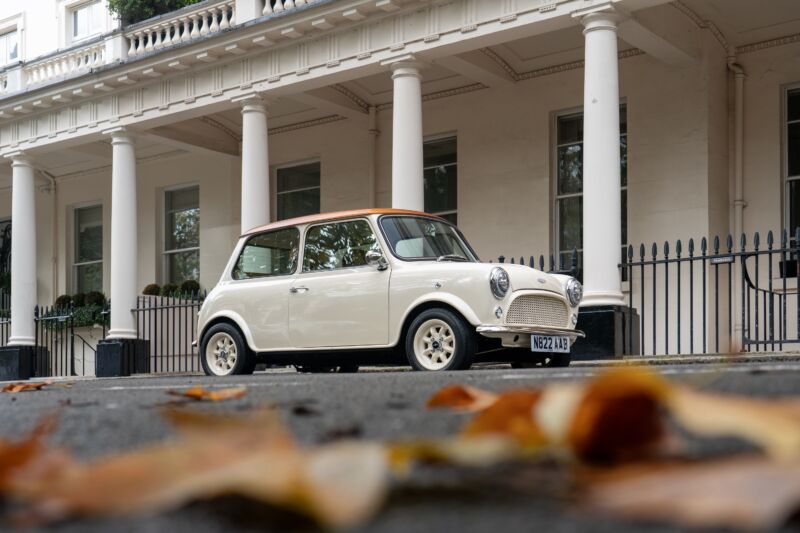 A mini cream Cooper restomod parked in London