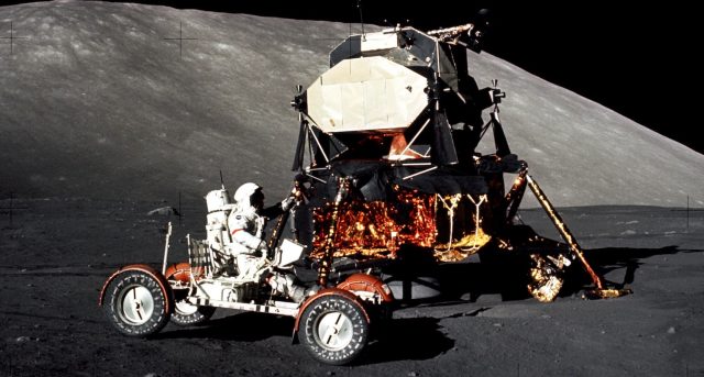 Apollo 17 commander Gene Cernan drives a lunar rover, with the lunar lander visible in the background. Apollo 17 spent 75 hours on the lunar surface, the longest stay at the Moon of any human mission. Apollo 17 mission commander Eugene Cernan drives the lunar roving vehicle during the early part of the mission's first moonwalk at the Taurus-Littrow landing site. The Lunar Module is in the background.