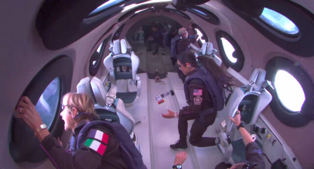 Inside the SpaceShipTwo cabin: Ketty Pucci-Sisti Maisonrouge (lower left), Kellie Gerardi (right center), and Alan Stern (upper right).