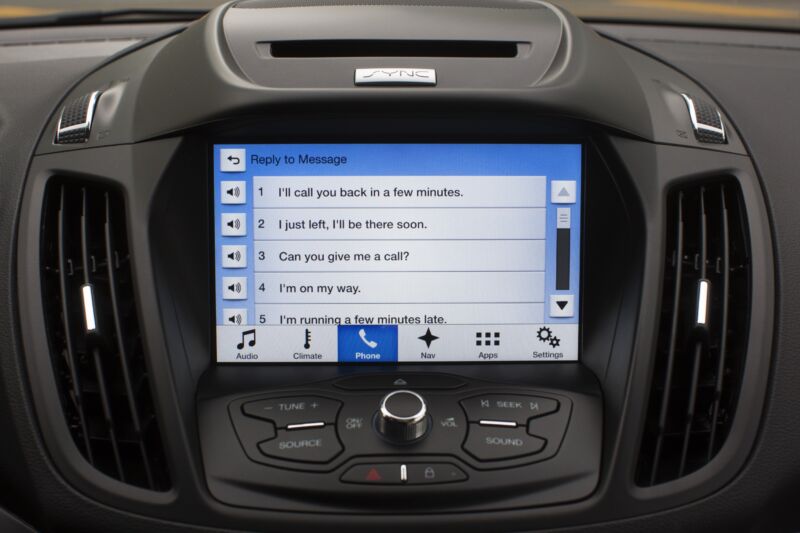 A Ford Escape infotainment system shows a list of messages.