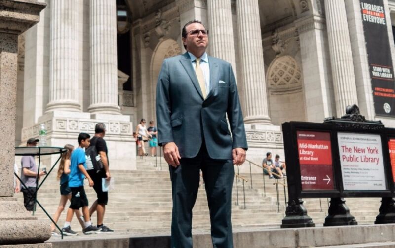 Attorney David Schwartz poses for a picture in front of the New York Public Library.
