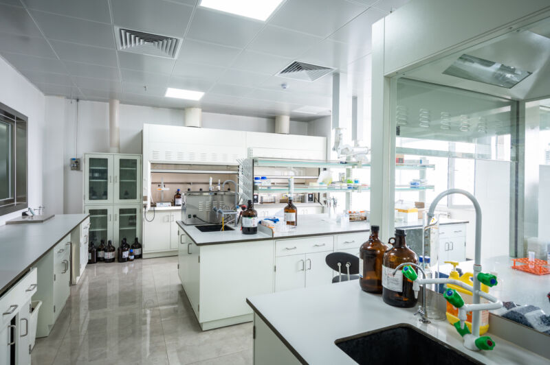 Image of a lab with chemicals, but no people present.