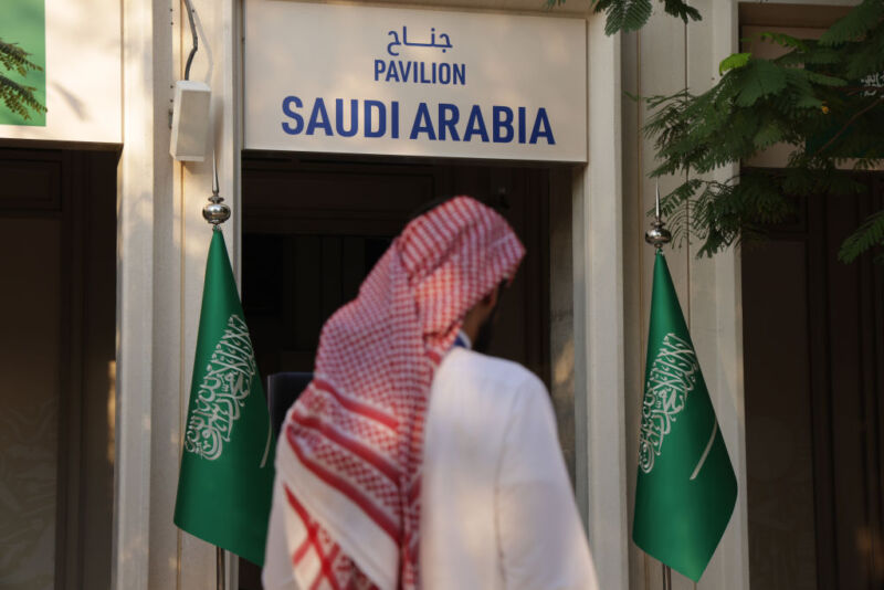 Image of a person standing in front of a doorway with 