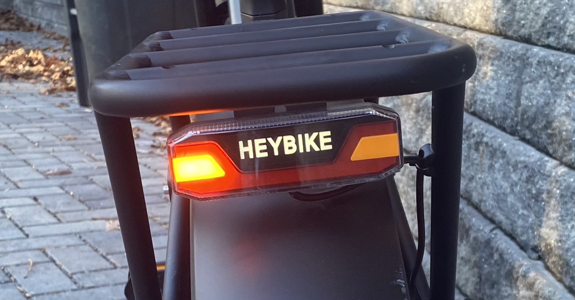 Image of a set of lights in an assembly on the rear of a bicycle, with a directional indicator lit.