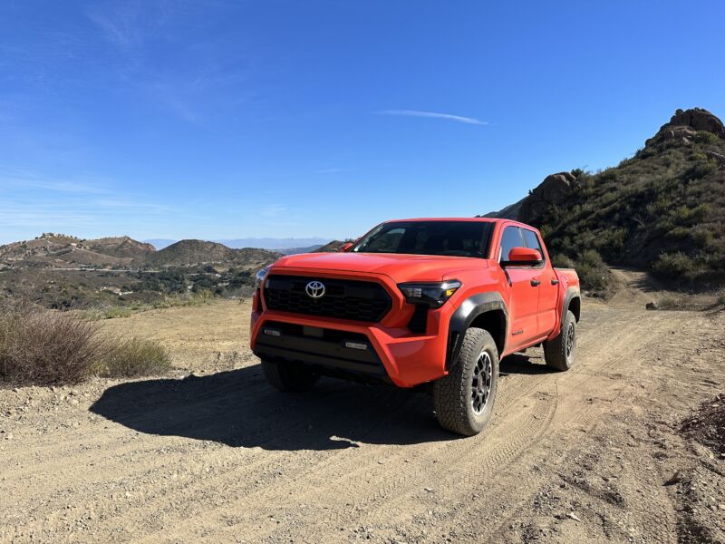 A red Toyota Tacoma TRD seen on a trail