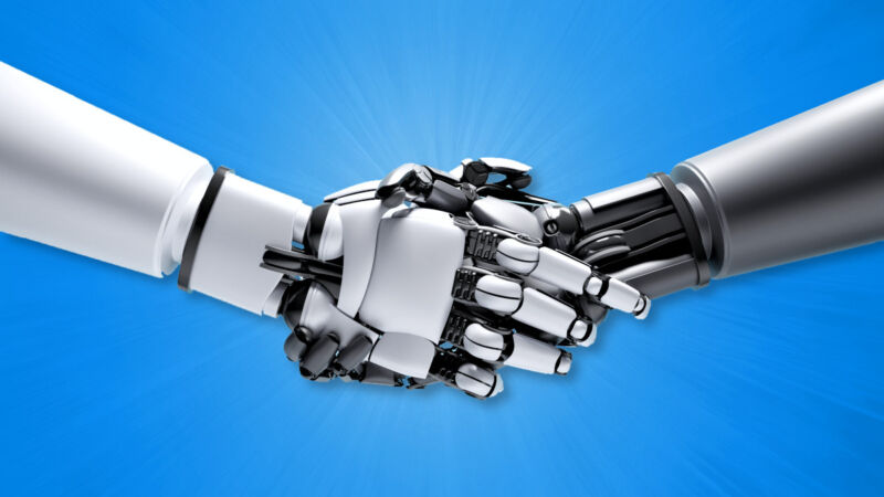 Robots shaking hands on a blue background.
