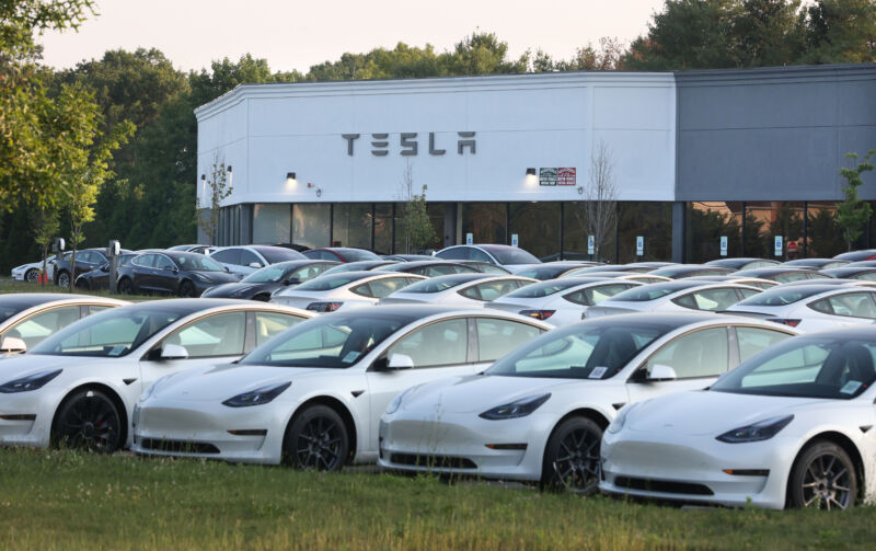 New Tesla electric vehicles fill the car lot at the Tesla retail location on Route 347 in Smithtown, New York on July 5, 2023.