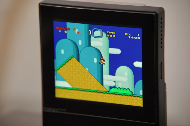 An Analogue Pocket running <em>Super Mario World</em> on an openFPGA core with the scanline filter enabled.