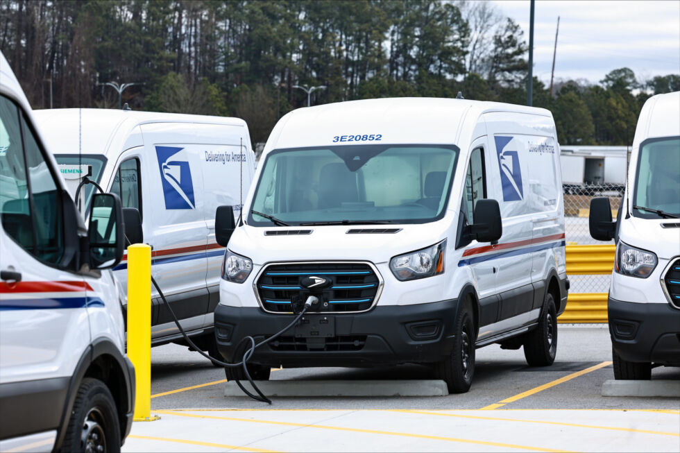 A Ford e-Transit van charges at the USPS's first EV charging station in Atlanta, Georgia.