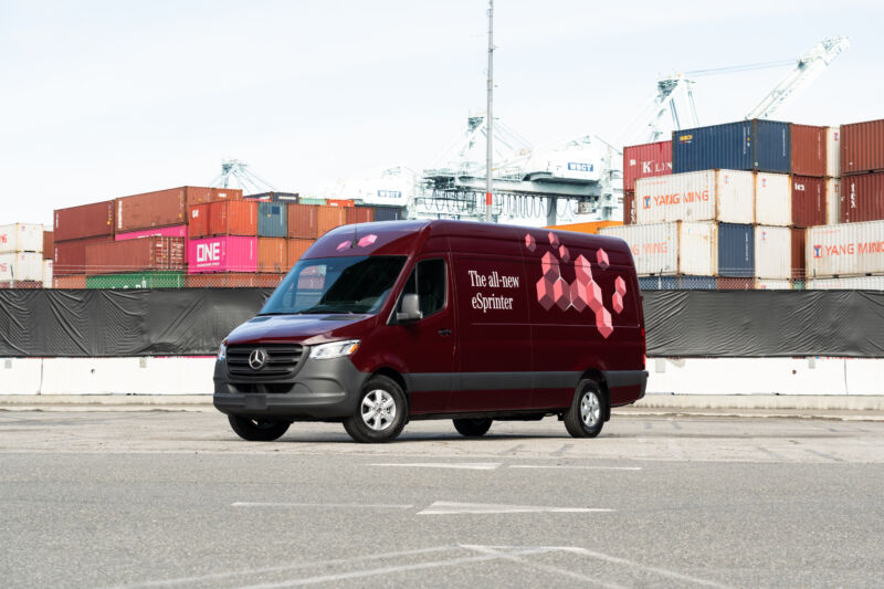 A maroon Mercedes-Benz eSprinter with a cargo port in the background.