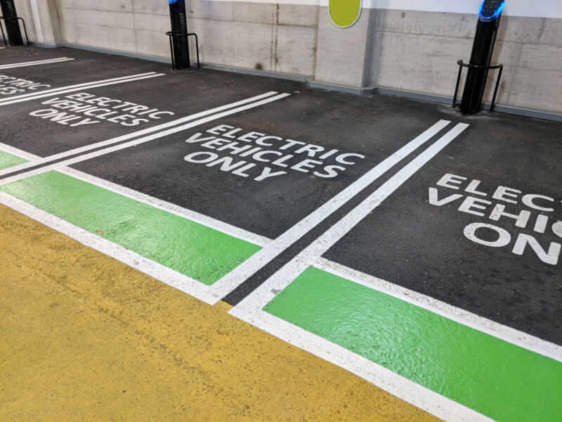 A row of empty EV charging spaces