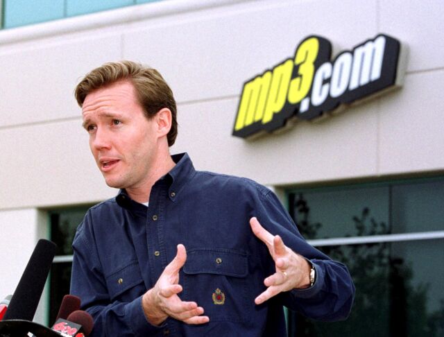 Michael Robertson, founder and CEO of MP3.com, speaks in front of the company headquarters in San Diego on May 21, 2001, the day it was acquired by record label Vivendi Universal.