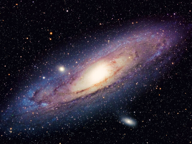 Our galaxy, the Milky Way, is thought to look similar to Andromeda (seen here) if you could see it from a distance. But since we're inside the galaxy, all we can see is the edge of the galactic plane.