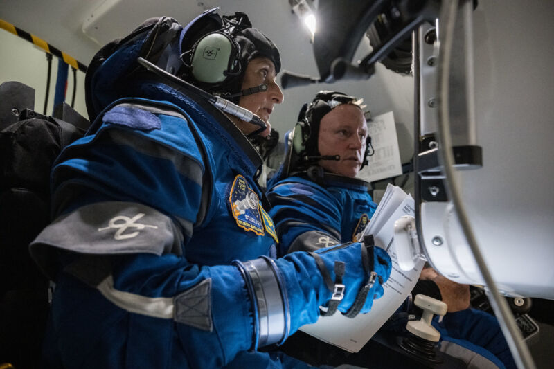 Astronauts Suni Williams (left) and Butch Wilmore (right) inside a Starliner simulator at NASA's Johnson Space Center in Houston.