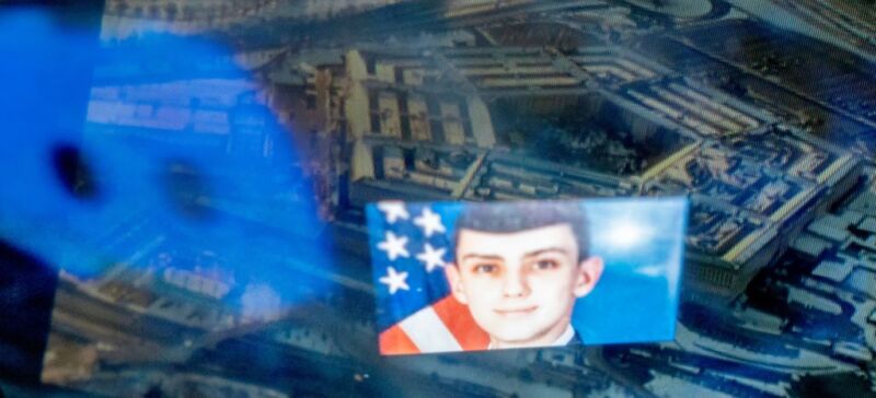 This photo illustration created on April 13, 2023, shows the Discord logo and the suspect, national guardsman Jack Teixeira, reflected in an image of the Pentagon in Washington, DC.