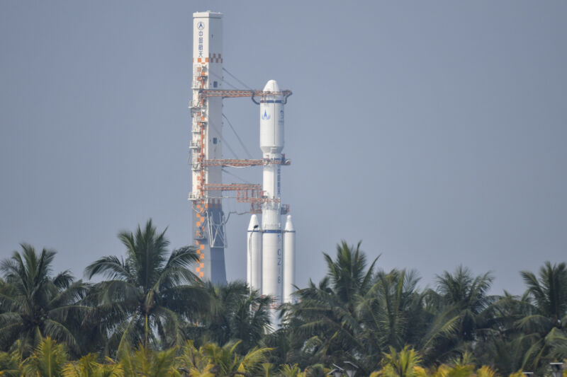 A Long March 8 rocket, standing 165 feet (50 meters) tall, rolled out of its assembly building to its launch pad Sunday at the Wenchang Space Launch Site.