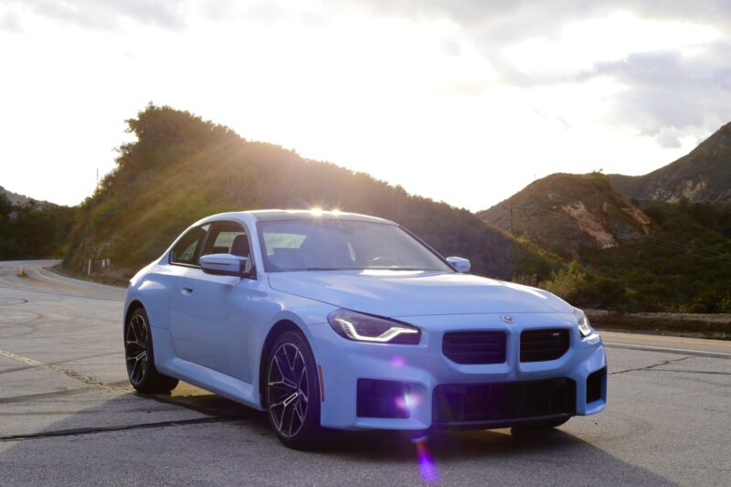 A pale blue BMW M2 seen parked in the hills