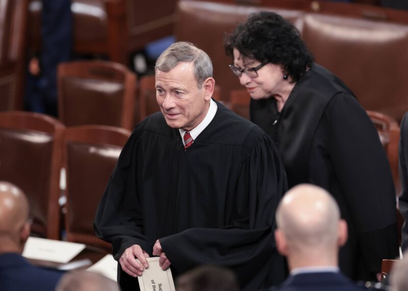 Supreme Court Chief Justice John Roberts and Associate Justice Sonia Sotomayor wearing their robes as they arrive for the State of the Union address.