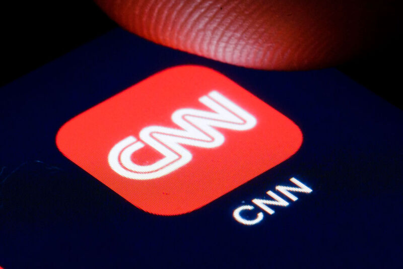 : The logo of the US tv channel CNN is shown on the display of a smartphone on April 22, 2020