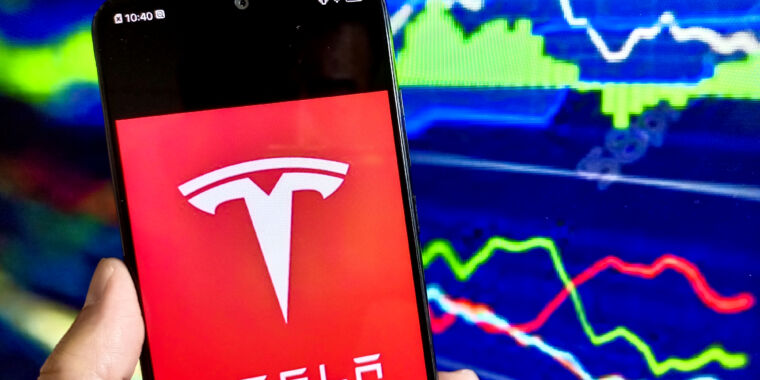 Tesla profits drop 55% as Elon Musk dodges cheap car questions
