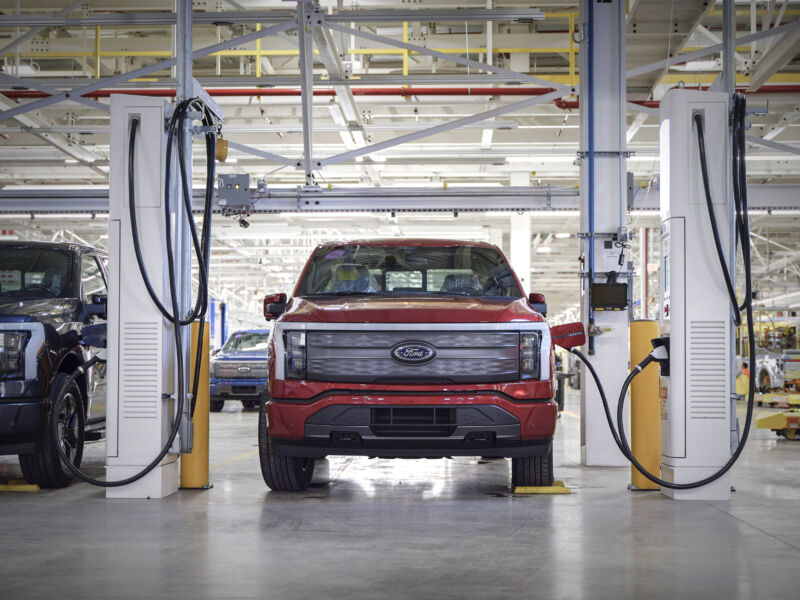 A ford F-150 Lightning being charged at the production line