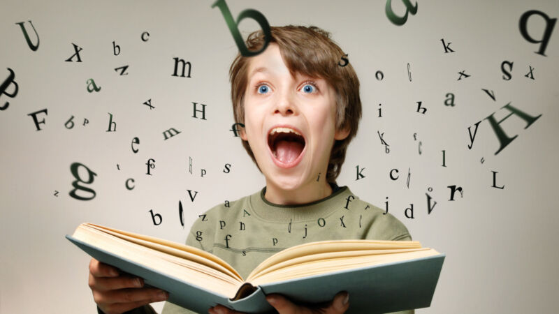 An image of a boy amazed by flying letters.