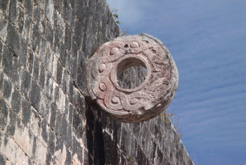 A decorative ring made from carved stone is embedded in the wall of a ballcourt in the ancient Maya city of Chichen Itza.